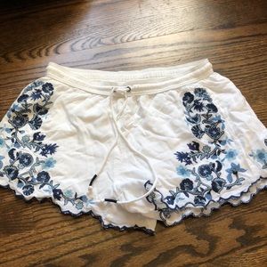 White flowy shorts with blue flowers